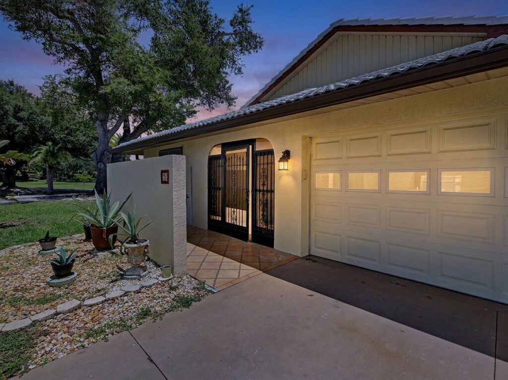 20 Idle Sands Dr, Venice: Front entry at dusk